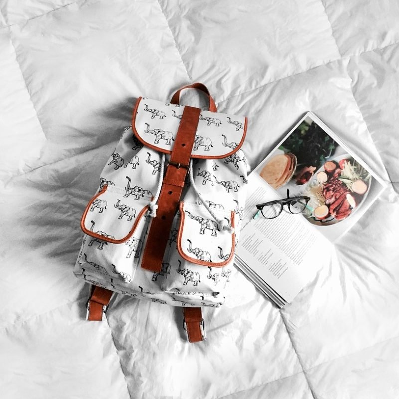 backpack, bed, book